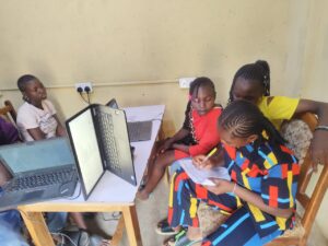 Students and community members accessing digital learning and online services at the hub.