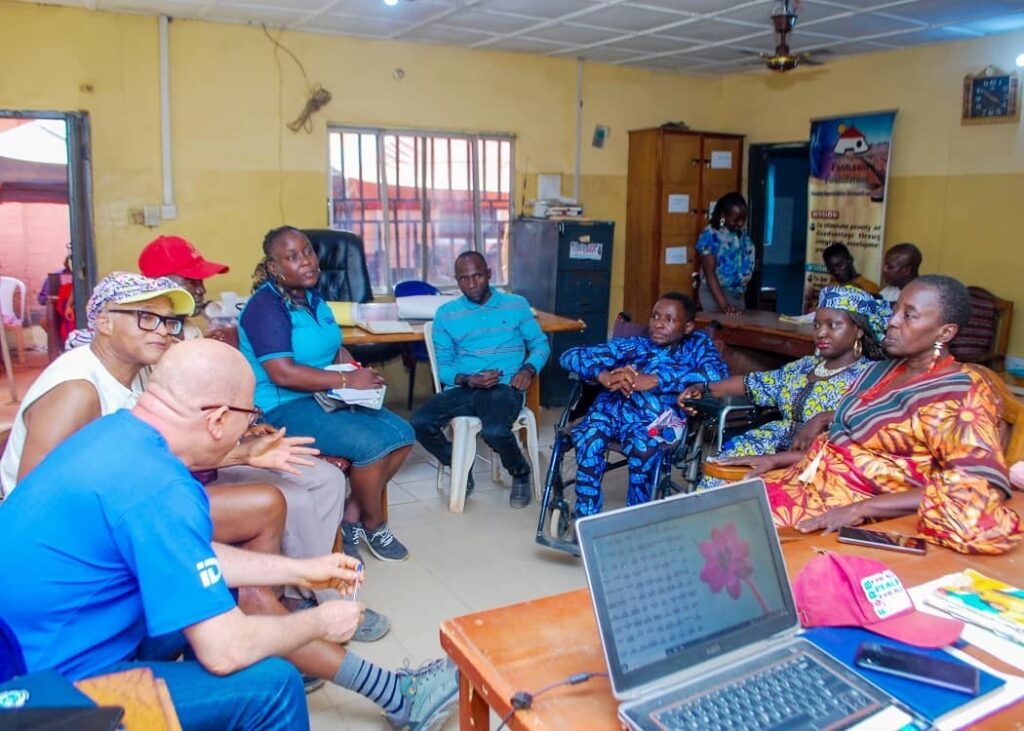 Osondu Nwokoro- IDI in a meeting with the management team of the Bayan Loco Albarka Community Self-Built Connectivity Hub, which include 2 persons with disabilities