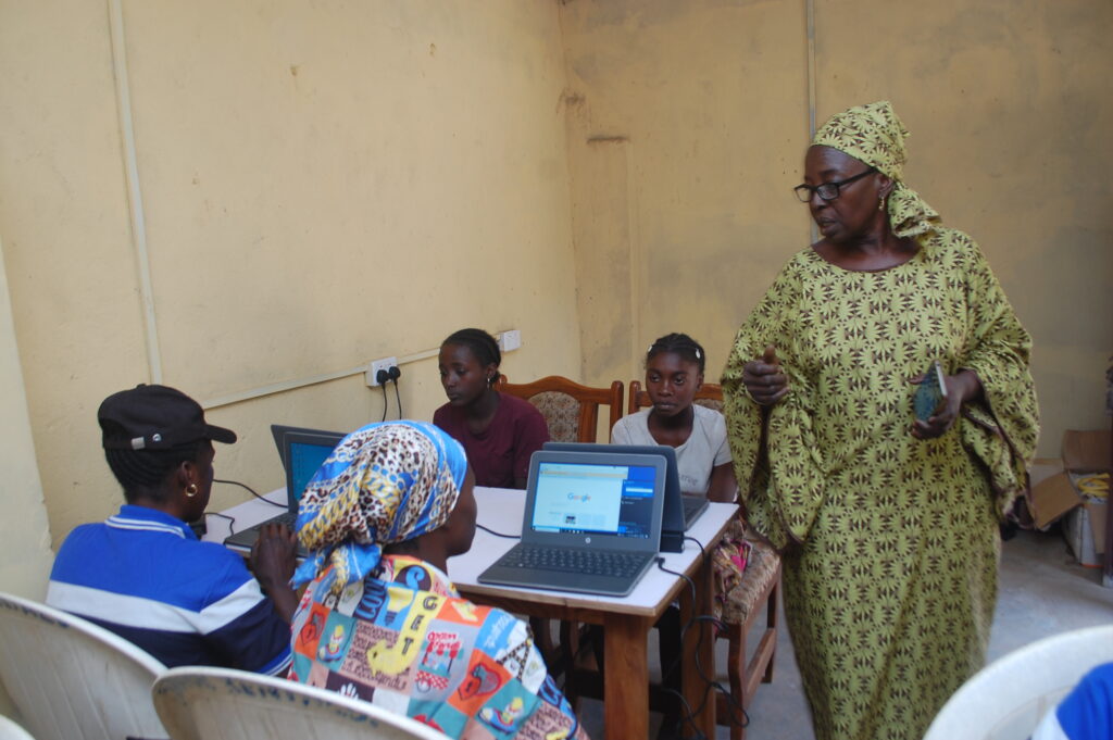 Ms. Theresa facilitating an interactive demonstration session with participants.